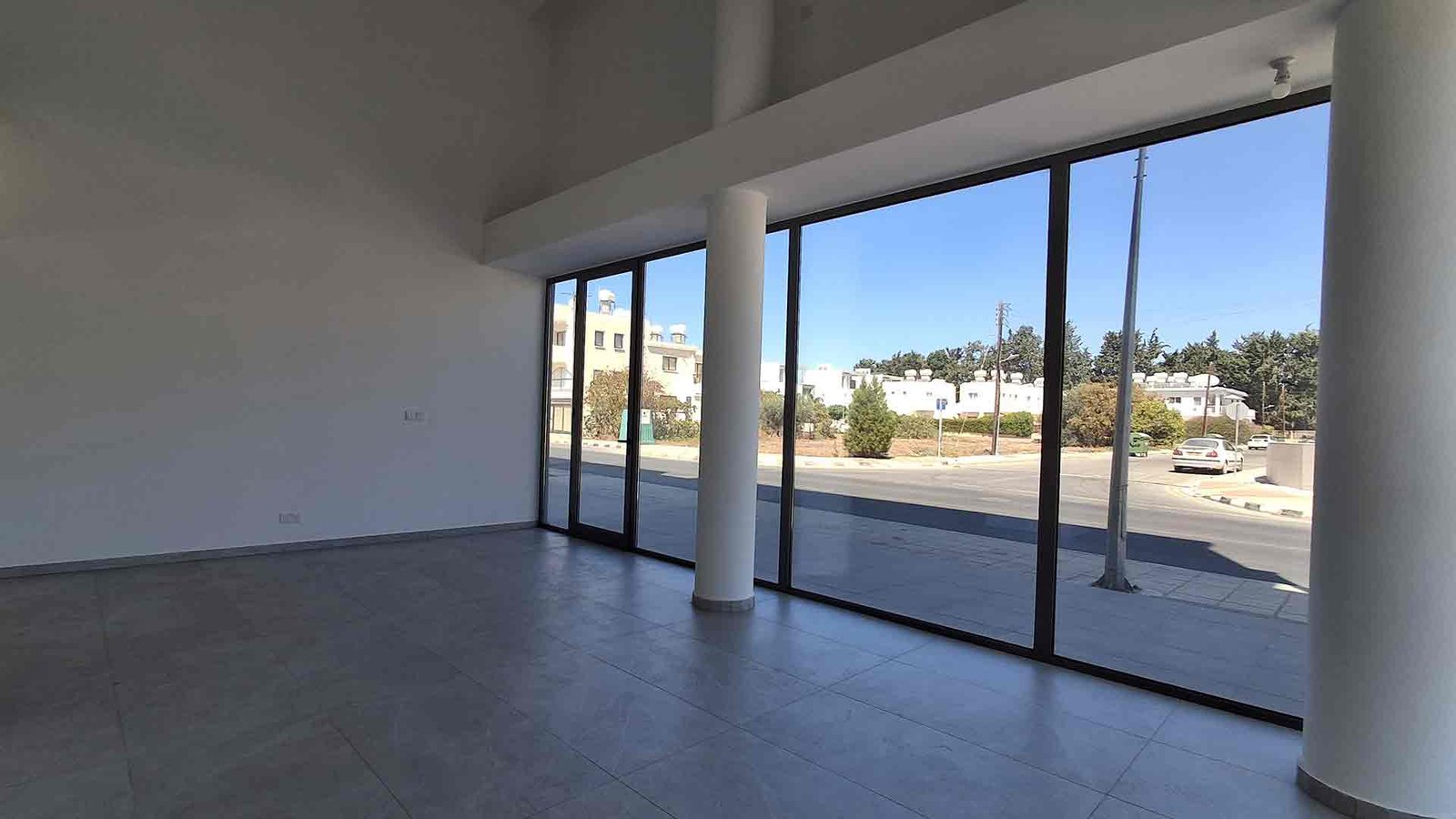 Interior open space of shop for sale in Kato Paphos with tiled floors and bright layout
